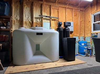 Low-yield well treatment system with 300-gallon storage tank, 5-stage filtration, softener, and UV