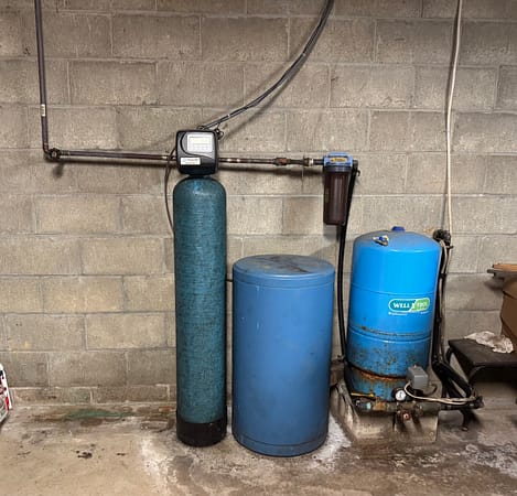Old water treatment equipment — before professional replacement