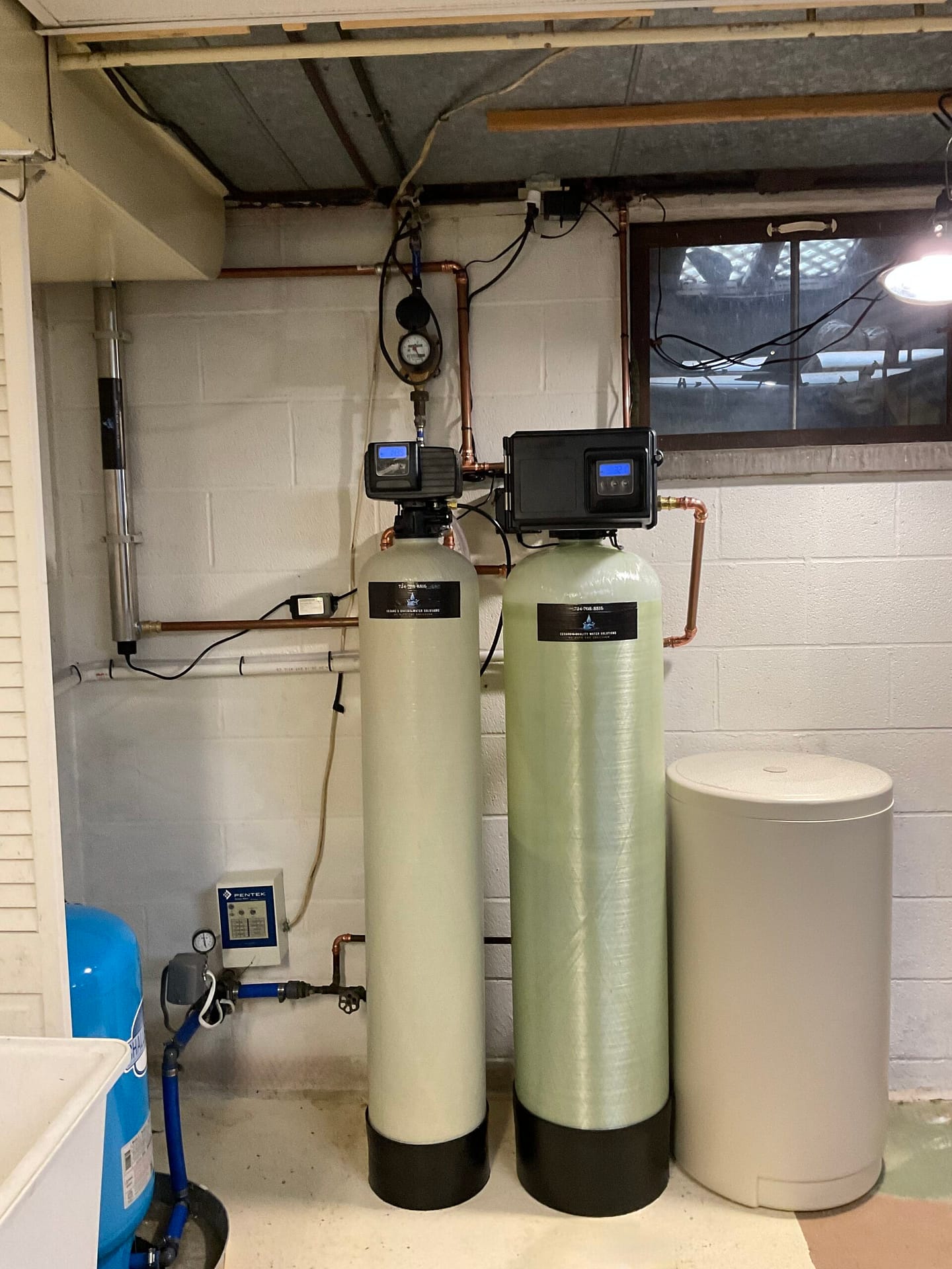 Cesare's complete water treatment installation with acid neutralization, iron filtration, softener, and UV in Southwestern PA basement