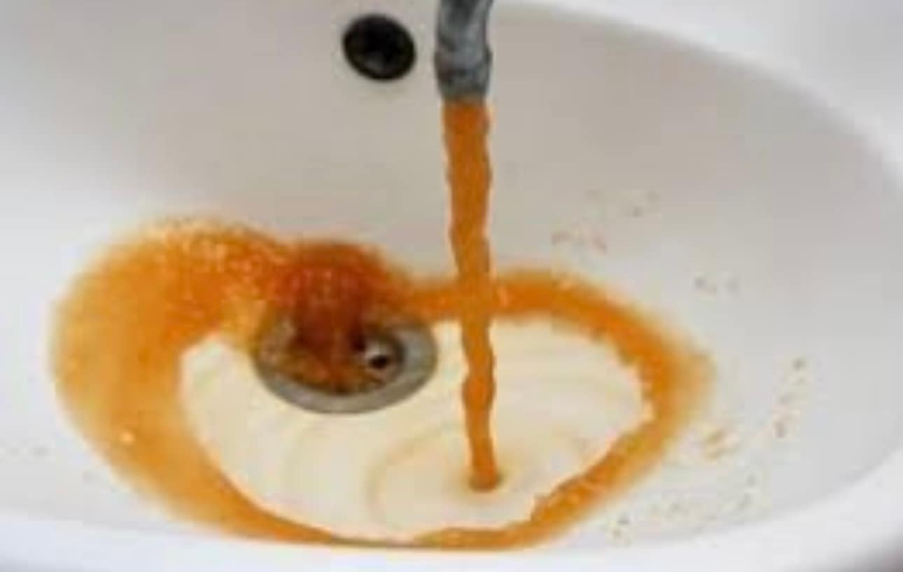Glass of brown iron-contaminated well water in Southwestern PA